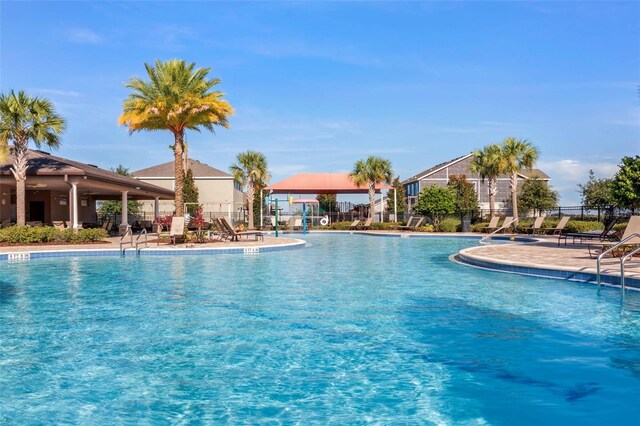 391 Cheeota Ct, Minneola, FL 34715 - community pool featuring a patio