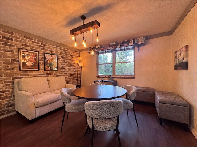 3664 SE 45th Pl, Ocala, FL 34480 - dining room with a textured ceiling, dark wood-style floors, brick wall, and a textured wall