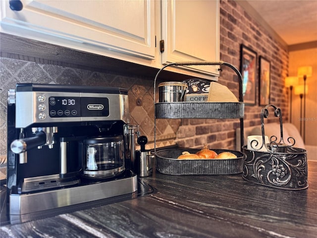 3664 SE 45th Pl, Ocala, FL 34480 - kitchen view of dark countertops and white cabinetry