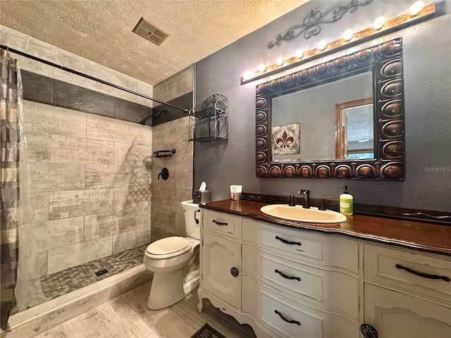 3664 SE 45th Pl, Ocala, FL 34480 - full bath featuring vanity, tiled shower, and a textured ceiling