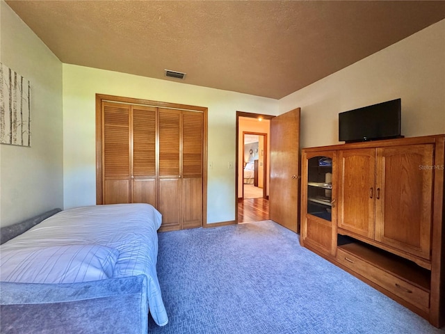 3664 SE 45th Pl, Ocala, FL 34480 - carpeted bedroom with a closet and a textured ceiling