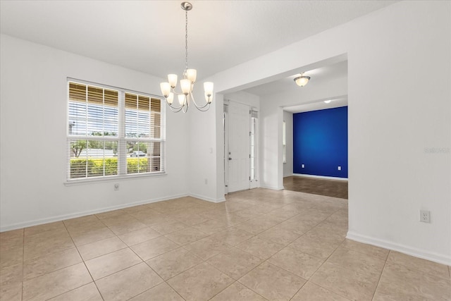 752 Sandy Bar Dr, Winter Garden, FL 34787 - empty room featuring light tile patterned floors and a chandelier