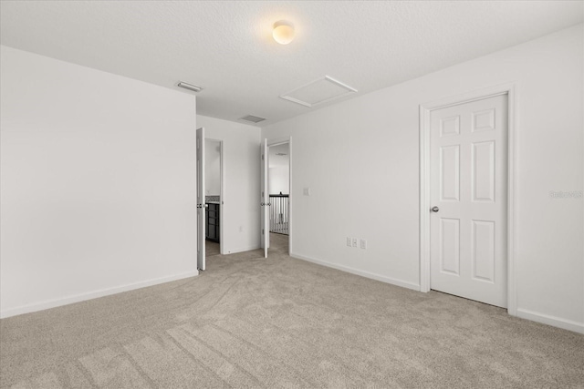 752 Sandy Bar Dr, Winter Garden, FL 34787 - unfurnished bedroom featuring attic access and light colored carpet
