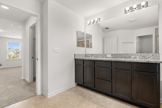 752 Sandy Bar Dr, Winter Garden, FL 34787 - bathroom with double vanity and tile patterned flooring