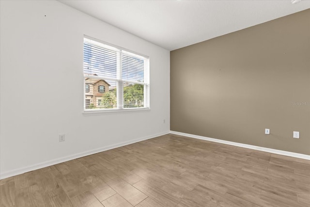 752 Sandy Bar Dr, Winter Garden, FL 34787 - empty room with baseboards and light wood-style flooring