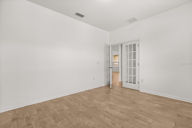 752 Sandy Bar Dr, Winter Garden, FL 34787 - empty room featuring french doors and light wood-type flooring