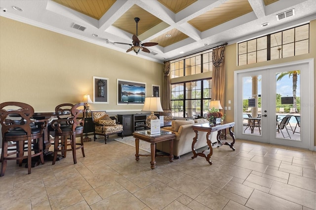 752 Sandy Bar Dr, Winter Garden, FL 34787 - living area featuring coffered ceiling, a high ceiling, beam ceiling, a ceiling fan, and crown molding