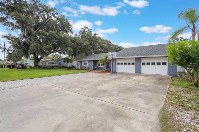 11750 Watts Ct, Tavares, FL 32778 - view of front facade with driveway, a front lawn, a garage, and roof with shingles