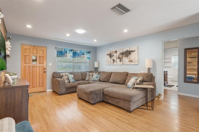 11750 Watts Ct, Tavares, FL 32778 - living area featuring light wood-style floors and recessed lighting