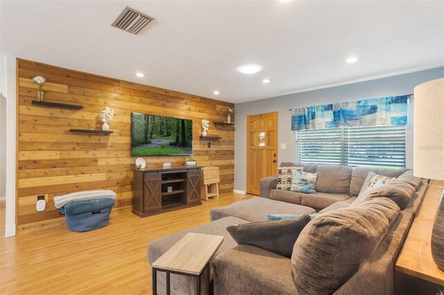 11750 Watts Ct, Tavares, FL 32778 - living area with recessed lighting, wooden walls, and wood finished floors