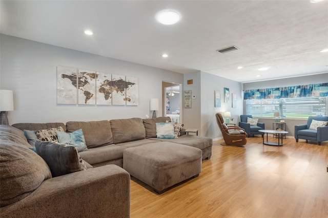 11750 Watts Ct, Tavares, FL 32778 - living room featuring light wood-style floors and recessed lighting