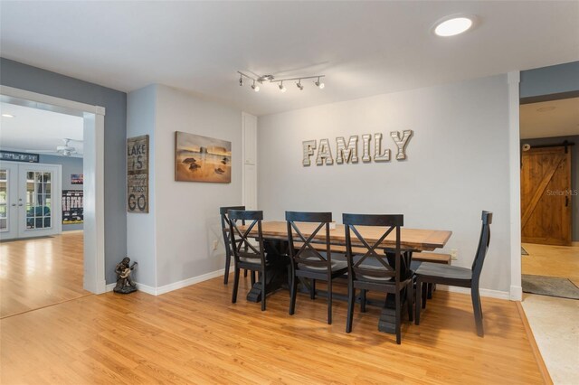 11750 Watts Ct, Tavares, FL 32778 - dining area featuring light wood-style flooring and french doors