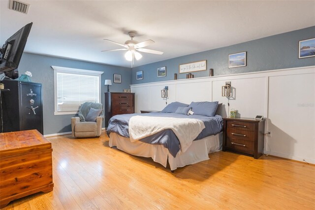 11750 Watts Ct, Tavares, FL 32778 - bedroom with light wood finished floors and ceiling fan