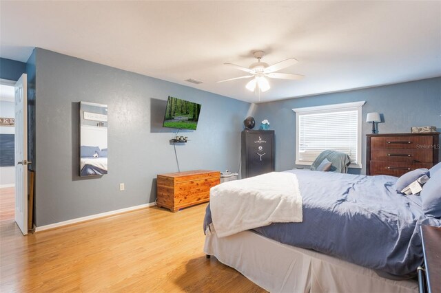 11750 Watts Ct, Tavares, FL 32778 - bedroom featuring light wood-style flooring and ceiling fan