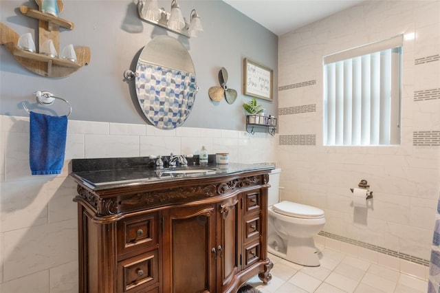 11750 Watts Ct, Tavares, FL 32778 - bathroom featuring tile walls, vanity, tile patterned floors, and a shower with shower curtain