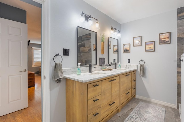 11750 Watts Ct, Tavares, FL 32778 - bathroom featuring double vanity and wood finished floors