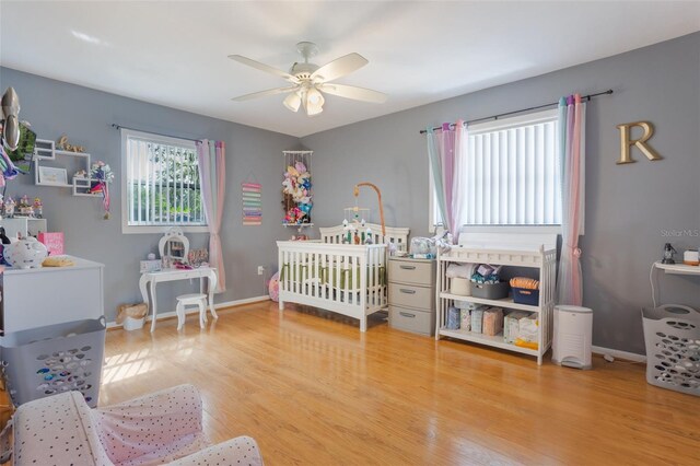 11750 Watts Ct, Tavares, FL 32778 - bedroom featuring wood finished floors and a ceiling fan