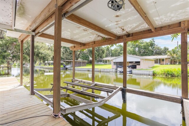 11750 Watts Ct, Tavares, FL 32778 - dock featuring boat lift and a water view