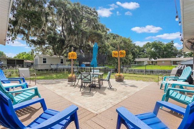 11750 Watts Ct, Tavares, FL 32778 - fenced backyard with a patio area and outdoor dining space