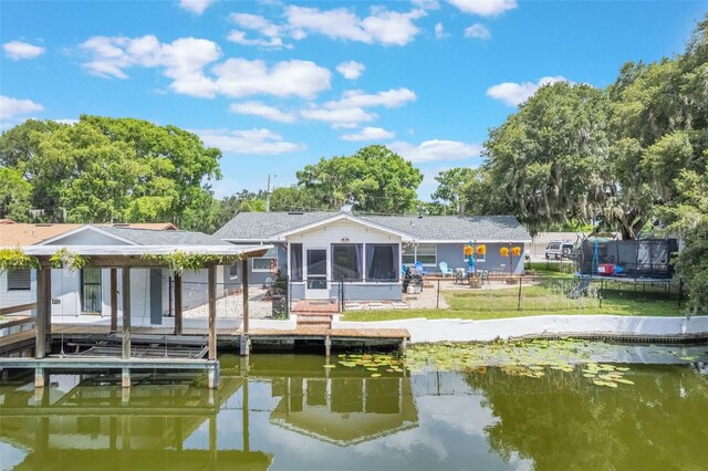 11750 Watts Ct, Tavares, FL 32778 - dock with a water view and a fenced backyard