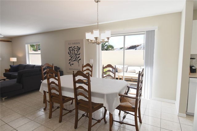1325 Balboa Ct, The Villages, FL 32159 - dining area with light tile patterned flooring and a chandelier