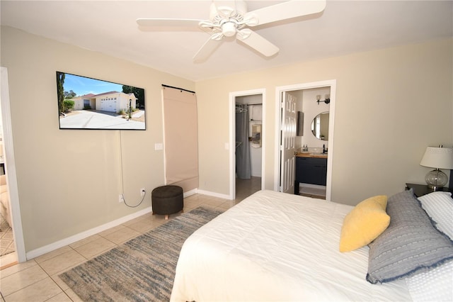 1325 Balboa Ct, The Villages, FL 32159 - bedroom featuring tile patterned floors, ensuite bathroom, a spacious closet, ceiling fan, and a closet