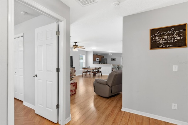 2336 Martins Run, Tavares, FL 32778 - hall featuring light wood finished floors
