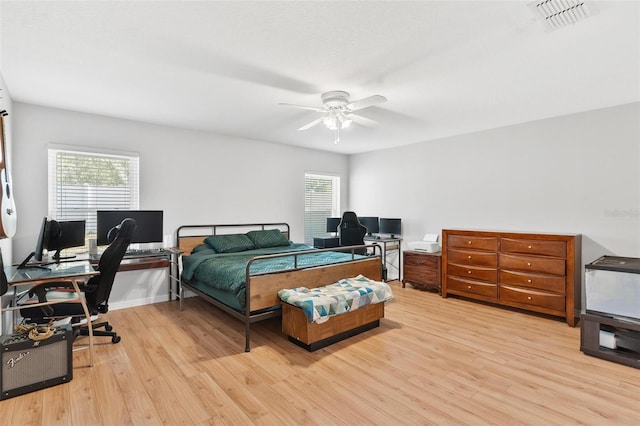 2336 Martins Run, Tavares, FL 32778 - bedroom with light wood-style flooring, an office area, and ceiling fan