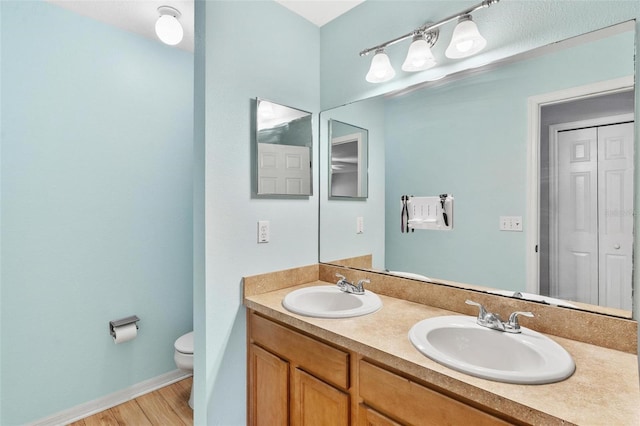 2336 Martins Run, Tavares, FL 32778 - full bathroom featuring double vanity and wood finished floors