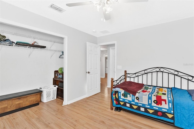 2336 Martins Run, Tavares, FL 32778 - bedroom featuring wood finished floors, a ceiling fan, and a closet