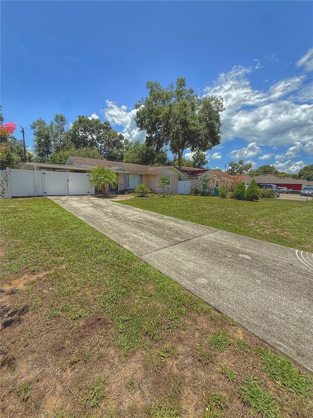 100 W Idlewild Ave, Eustis, FL 32726 - view of yard with driveway and a gate