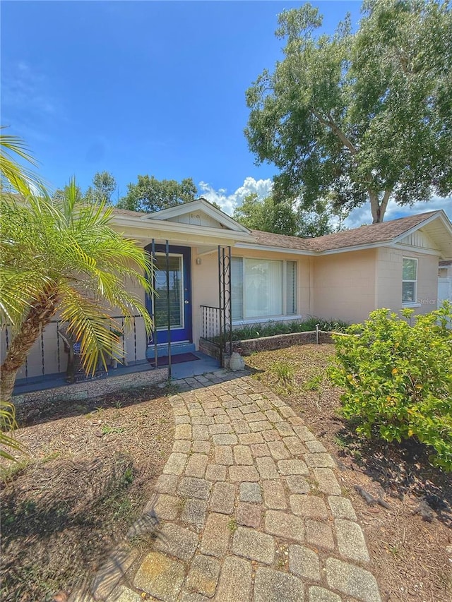 100 W Idlewild Ave, Eustis, FL 32726 - view of front of home with a porch and stucco siding