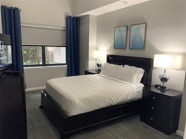 14501 Grove Resort Ave Unit 3406, Winter Garden, FL 34787 - bedroom featuring dark colored carpet and baseboards