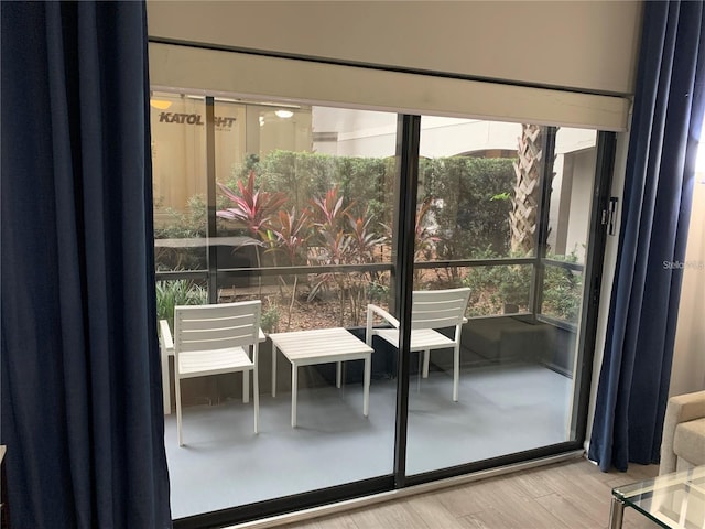 14501 Grove Resort Ave Unit 3406, Winter Garden, FL 34787 - doorway to outside featuring wood finished floors