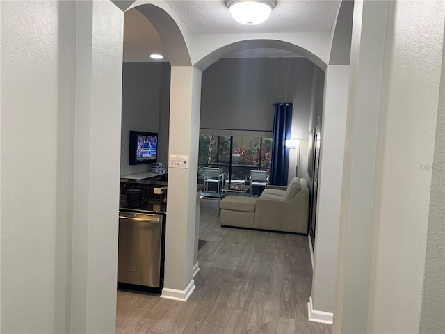 14501 Grove Resort Ave Unit 3406, Winter Garden, FL 34787 - corridor with light wood-style flooring and baseboards