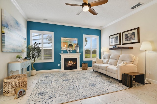 1426 Lakemist Ln, Clermont, FL 34711 - living room featuring tile patterned floors, crown molding, a ceiling fan, plenty of natural light, and a textured ceiling