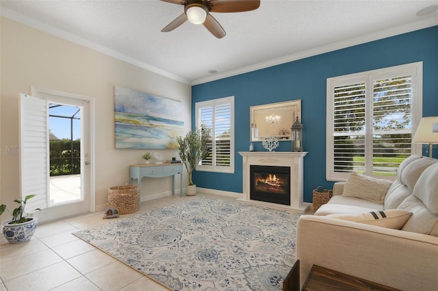 1426 Lakemist Ln, Clermont, FL 34711 - tiled living room with a ceiling fan, ornamental molding, plenty of natural light, and a glass covered fireplace