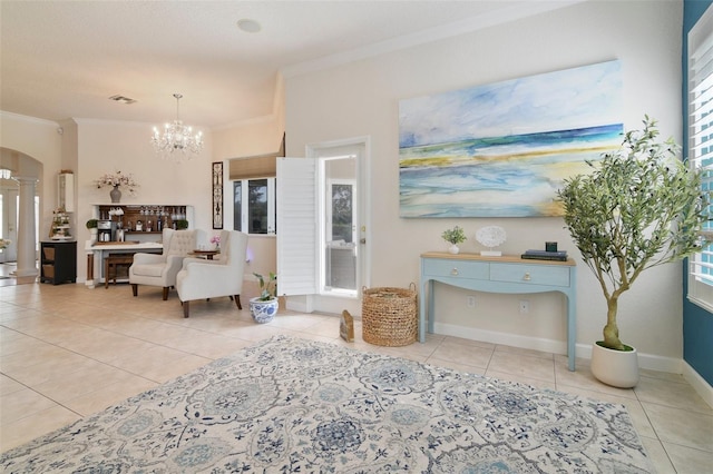 1426 Lakemist Ln, Clermont, FL 34711 - living room featuring ornamental molding, tile patterned floors, ornate columns, a chandelier, and plenty of natural light