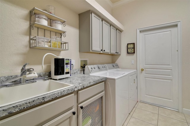 1426 Lakemist Ln, Clermont, FL 34711 - laundry room with cabinet space, washer and clothes dryer, light tile patterned floors, and crown molding