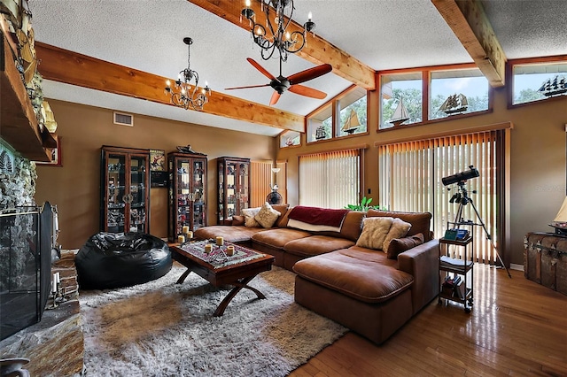 672 E Belt Ave, Bushnell, FL 33513 - living area with a chandelier, a textured ceiling, hardwood / wood-style floors, ceiling fan, and baseboards