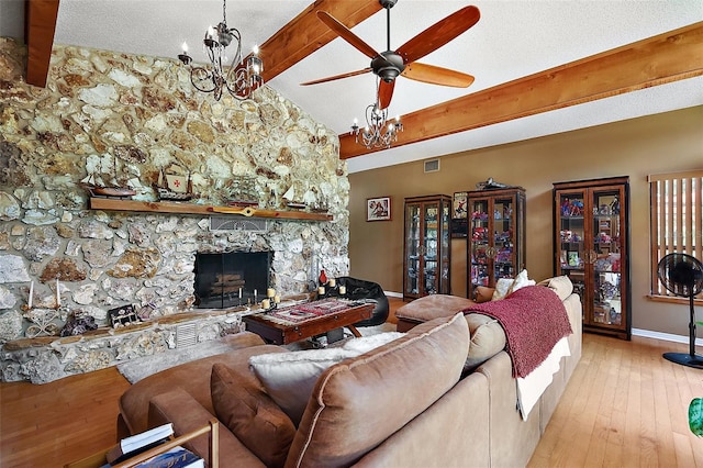672 E Belt Ave, Bushnell, FL 33513 - living area with a ceiling fan, baseboards, a fireplace, a chandelier, and hardwood / wood-style flooring