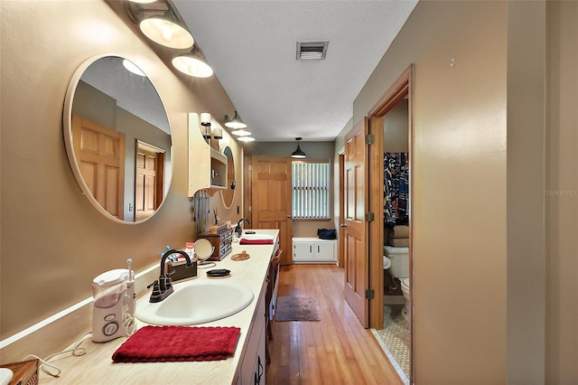 672 E Belt Ave, Bushnell, FL 33513 - full bath with wood-type flooring and double vanity