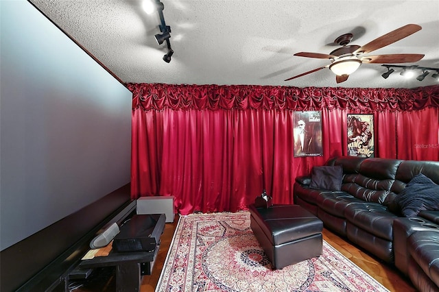 672 E Belt Ave, Bushnell, FL 33513 - living area featuring rail lighting, a textured ceiling, and a ceiling fan