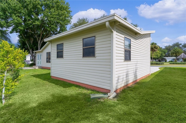1815 Kaufman Cir, Lady Lake, FL 32159 - view of property exterior featuring a lawn