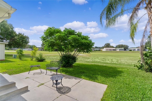 1815 Kaufman Cir, Lady Lake, FL 32159 - view of green lawn with a patio area
