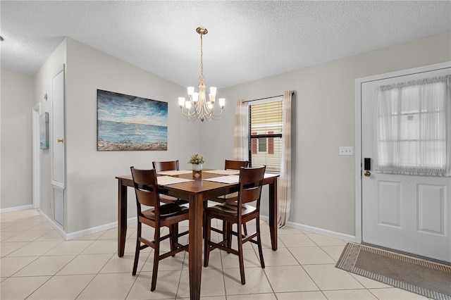 1815 Kaufman Cir, Lady Lake, FL 32159 - dining area featuring a chandelier, a textured ceiling, and light tile patterned flooring