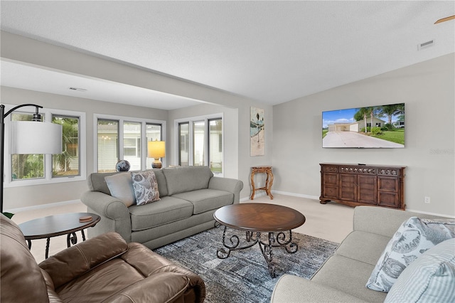 1815 Kaufman Cir, Lady Lake, FL 32159 - carpeted living area with baseboards and vaulted ceiling
