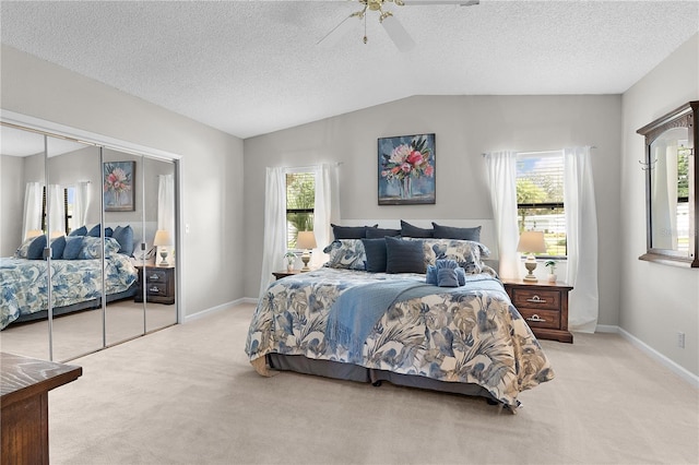 1815 Kaufman Cir, Lady Lake, FL 32159 - bedroom featuring light colored carpet, multiple windows, lofted ceiling, a ceiling fan, and a textured ceiling