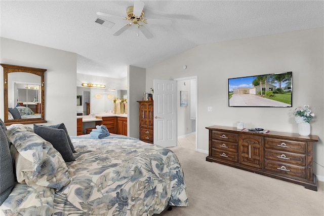 1815 Kaufman Cir, Lady Lake, FL 32159 - bedroom with light colored carpet, lofted ceiling, a textured ceiling, a ceiling fan, and ensuite bathroom