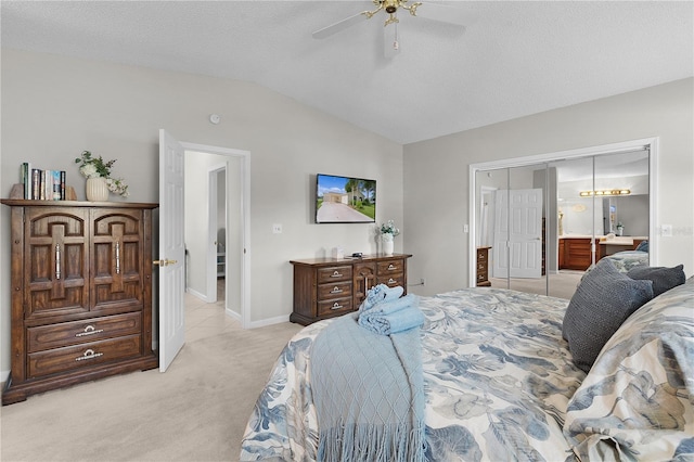 1815 Kaufman Cir, Lady Lake, FL 32159 - bedroom featuring vaulted ceiling, light carpet, ceiling fan, and ensuite bath